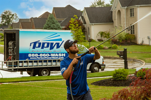 Perfect Power Wash technician in front of truck