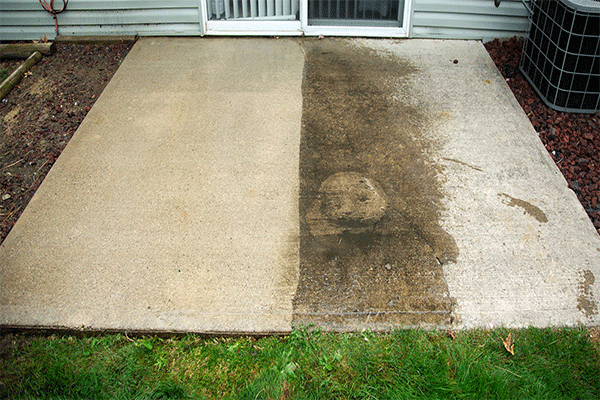 Before and after washing concrete patio