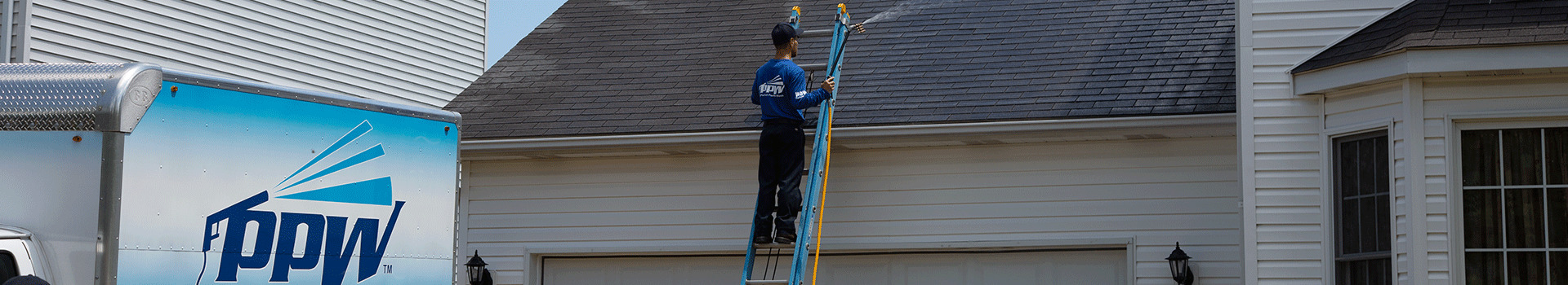 Perfect Power Wash technician performing a roof treatment